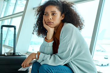 Image showing Airport, flight delay and depressed woman sad for immigration fail, passport or schedule problem. Young USA person with luggage and ticket with stress, anxiety and thinking of airplane travel crisis