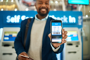 Image showing Airport, travel and man with a boarding pass on his phone to check in before his flight for a work trip. Technology, professional and African business male with a electronic plane ticket on cellphone