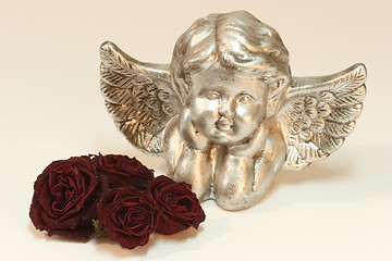 Image showing Golden cupid with roses