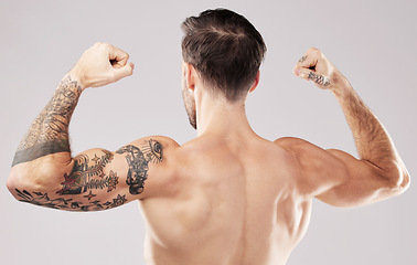 Image showing Back, muscular and man with skincare, bodybuilder and fitness against grey studio background. Male, gentleman and athlete with muscles, dermatology and training for competition, workout and backdrop