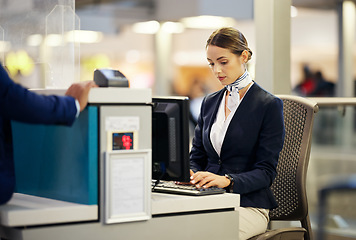 Image showing Airport, check in desk and woman typing for security, identity and travel documents for border immigration service. Concierge, customer service and help for global transportation with pc on table