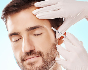 Image showing Face, cosmetic injection and mesotherapy with man, hands and needle syringe, skincare and medical on blue background. Healthcare, beauty and healthy skin with procedure, cosmetics and dermatology