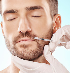 Image showing Man, lip filler and mesotherapy with face, hands and needle syringe, injection and beauty on blue background. Dermatology, cosmetic care and procedure, health and skincare with wellness and collagen