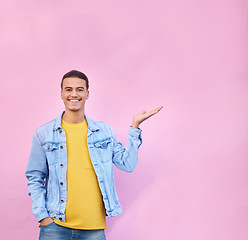 Image showing Happy, mockup and portrait of a man in a studio pointing to empty space for advertisement or marketing. Happiness, smile and male model showing mock up or copyspace isolated by a pink background.