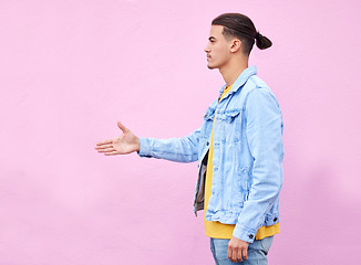 Image showing Hand shake, meeting and deal with man and wall background with mockup for greeting, agreement or thank you. Partnership, hello and approve with profile of guy and pink background for positive gesture