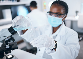 Image showing Science, covid and testing with a black woman doctor working in a laboratory for research or innovation. Medical, analytics and development with a female scientist at work in a lab for chemistry