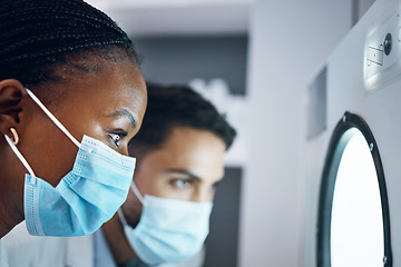 Image showing Science, researchers and incubator for experiment, healthcare and medical breakthrough in laboratory. Scientist, glass and employees with masks, innovation and test sample storage for data analysis