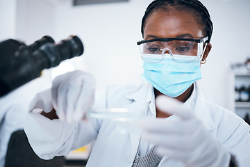 Image showing Science, covid and solution with a black woman doctor working in a laboratory for research or innovation. Medical, analytics and development with a female scientist at work in a lab for chemistry