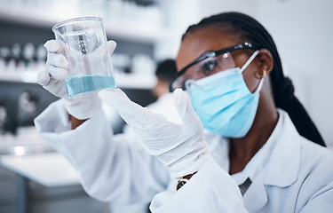 Image showing Science, covid and liquid with a black woman doctor working in a laboratory for research or innovation. Medical, analytics and development with a female scientist at work in a lab for chemistry