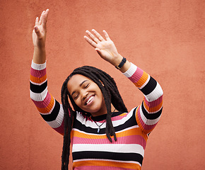 Image showing Happy, freedom and smile with black woman and dance for celebration, party and energy. Music, youth and happiness with girl dancing by wall background for fashion, summer and performance in Jamaica