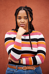 Image showing Wall, portrait and black woman with fashion, serious and casual outfit on studio background. Face, African American female and lady with trendy, edgy or confidence with girl, Jamaican and on backdrop