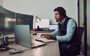Image showing Headphones, programmer and man on computer with book, coding or programming while writing notes at night. Information technology, notebook and male working on software while streaming music or radio.