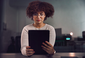 Image showing Tablet, programmer and woman in night office, research or programming online in workplace. Information technology, developer and female coder with glasses working on software project on touchscreen.