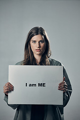 Image showing Woman, protest and poster in pride for self esteem, equality or human rights against gray studio background. Portrait of confident female activist with I am me message on board for unique empowerment