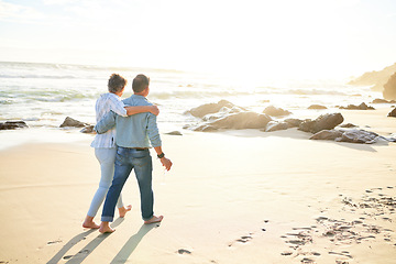 Image showing Beach, love and mockup with a senior couple walking on the sand by the ocean or sea for sunset romance. Nature, summer or back with a mature woman and man taking a romantic walk together on the coast