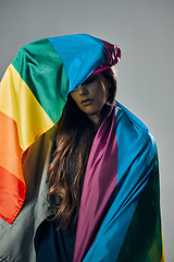 Image showing Rainbow flag, pride and woman, lgbtq and freedom to love, inclusion and equality, protest for human rights. Gay, trans and lesbian, politics and identity with community isolated on studio background