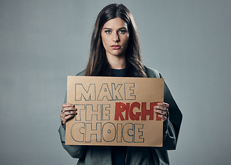 Image showing Vaccine, choice and portrait of a woman with a sign isolated on a grey studio background. Decision, showing and girl with a poster for healthcare, medical attention and safety from covid on backdrop