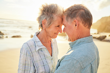 Image showing Beach, senior couple and love of people with care, smile and marriage by the ocean. Retirement, summer holiday and sea vacation of a man and woman together feeling love and support in nature on sand