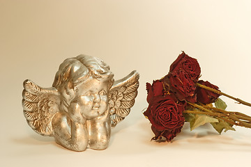 Image showing Angel with red roses