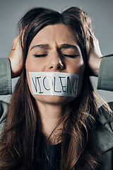 Image showing Woman, protest and tape on mouth in fear for cold war, armageddon or doomsday against a gray studio background. Female activist face with hands on head and message to stop or end global violence