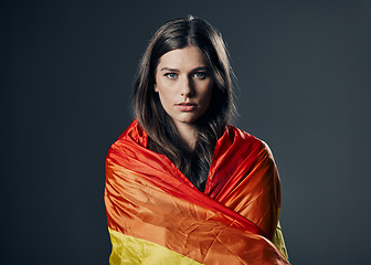 Image showing Flag, pride and woman in portrait, lgbtq and freedom to love, inclusion and equality, protest for human rights. Gay, trans and lesbian, politics and identity with lgbt community on studio background