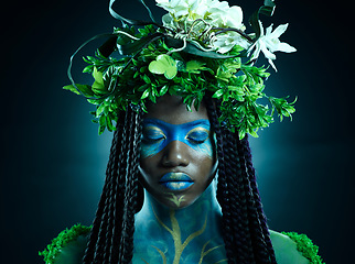 Image showing Black woman, plant crown and beauty of face with makeup on dark background with tropical leafs. Fairy model person or Queen of nature, ecology and sustainability for freedom art with natural wreath