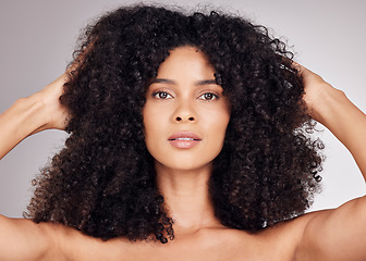 Image showing Beauty, hair care and portrait of a black woman feeling hairstyle texture after salon treatment. Isolated, gray background and model with haircut shine from cosmetics, self care and dermatology