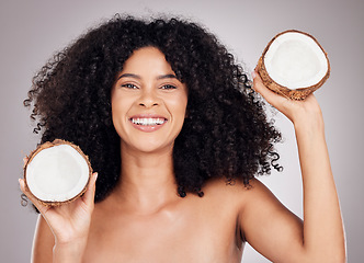 Image showing Coconut, beauty portrait and black woman isolated on studio background natural skincare, face and hair promotion. USA model or young person with fruit product and healthy oil benefits for dermatology