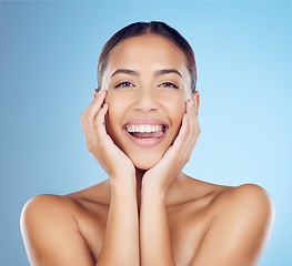 Image showing Skincare, beauty and woman with tongue out in studio for makeup, cosmetics and wellness. Happy model, portrait smile and clean teeth whitening for aesthetics, facial salon and glow on blue background