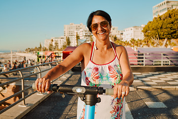 Image showing Portrait of woman on electric scooter, retirement and summer ride at tropical island resort for happy vacation. City, street and eco friendly transport, fun grandma on escooter on holiday in Hawaii.