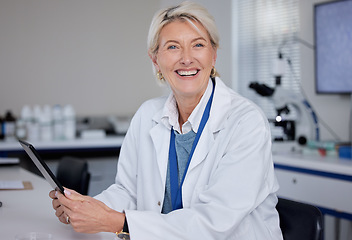 Image showing Portrait, doctor and senior woman with tablet in laboratory for science or medical research. Scientist, technology and smile of happy elderly female researcher from Canada holding digital touchscreen