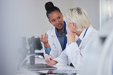 Image showing Teamwork, collaboration and doctors with laptop in laboratory for medical research or science. Computer, lab assistant or researchers, black woman and senior female, talking or discussing information