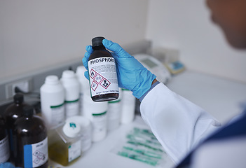 Image showing Hand, science or phosphorus and a doctor working in a lab with chemicals for an experiment or reaction. Medical, pharmacy and healthcare with a scientist at work in a laboratory for development