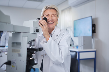 Image showing Mature woman, portrait or laboratory microscope in science research, future dna engineering or bacteria analytics. Happy smile or scientist on equipment for healthcare pharmacy test or medicine study