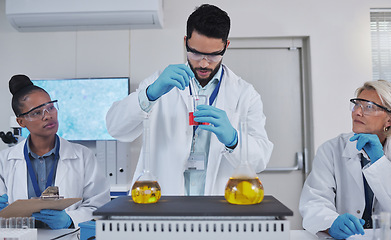 Image showing Team, chemistry and liquid in laboratory, science and teaching with experiment, test tube and development. Staff, scientist and researchers with analysis, cure and diagnosis in lab, focus and sample