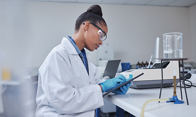 Image showing Research, focus scientist or black woman on tablet in lab for medical search, innovation or science study. Medicine, internet or doctor on tech for healthcare or wellness DNA data review in hospital