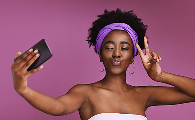 Image showing Phone, selfie and face of woman with peace sign on purple background for wellness, fashion and cosmetics. Beauty, skincare and happy girl influencer on smartphone for social media, picture and post