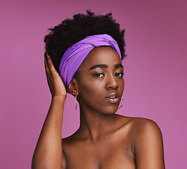 Image showing Portrait, hair and skincare with a model black woman on a pink background in studio for natural care. Face, haircare and headband with an attractive young female posing to promote cosmetic treatment