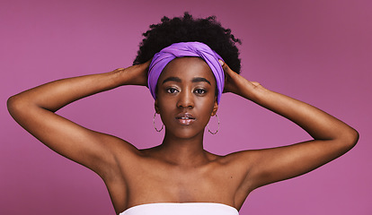 Image showing Portrait, beauty and hair with a model black woman on a pink background in studio for natural care. Face, skincare or headband and an attractive or confident young female wearing an afro hairstyle