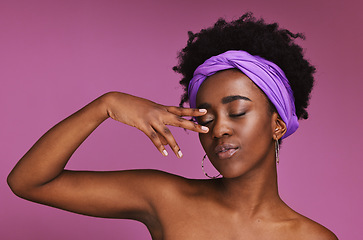 Image showing Face, beauty and skincare with a model black woman on a pink background in studio for natural care. Hand, hair and headband with an attractive young female posing to promote cosmetic treatment