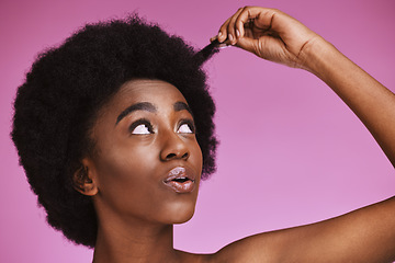 Image showing Natural, afro and hair with black woman in studio for beauty, wellness and grooming on purple background. Haircare, hairstyle and face of girl model relax in luxury, hygiene or routine while isolated