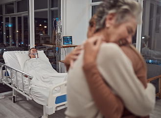 Image showing Hug, support and family at hospital with father lying in bed sick with cancer or illness. Sad, comfort and senior woman and girl hugging, embrace or cuddle for empathy, love and hope for life of man.