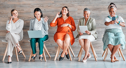 Image showing Diversity, women and waiting with devices, happiness and business with confidence, recruitment and job interview. Multiracial, female employees and staff with teamwork, digital connection and typing