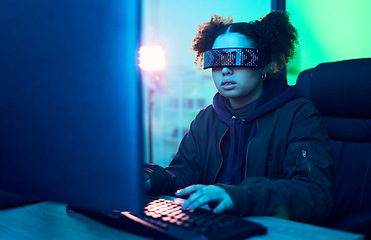 Image showing Computer hacker, cyberpunk and neon girl hacking software, online server or programming password phishing. Blue ransomware developer, cyber security glasses and night programmer coding malware code