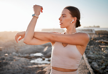 Image showing Beach fitness, health and woman stretching for cardio exercise running, marathon training or body healthcare goals. Nature freedom, calm peace and athlete warm up for outdoor performance workout