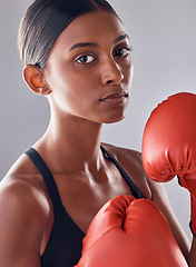 Image showing Boxer, gloves and portrait of woman in studio for sports exercise, strong muscle or mma training. Indian female, boxing workout and fist fight for impact, energy and warrior power in battle challenge