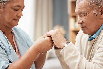 Image showing Bible, praying or old couple holding hands together in a Christian home in retirement with hope or faith. Jesus, religion or belief with a senior man and woman in prayer to god for spiritual bonding