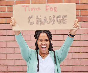 Image showing Protest, change and portrait of black woman with voice for human rights, gender equality and racism on brick wall. USA youth, gen z person or student with cardboard sign, freedom of speech and angry