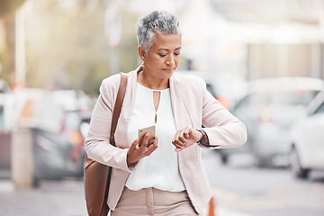 Image showing Woman in city, walking and checking time on wrist on morning commute to work or appointment. Street, schedule and businesswoman looking at watch on urban sidewalk before job interview or meeting.