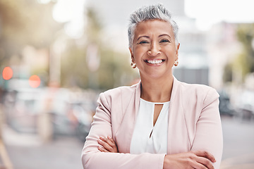 Image showing Portrait, city business and woman with arms crossed in Colombia, town and travel commute. Happy manager, mature female and smile in urban street for executive leadership, professional trust and goals